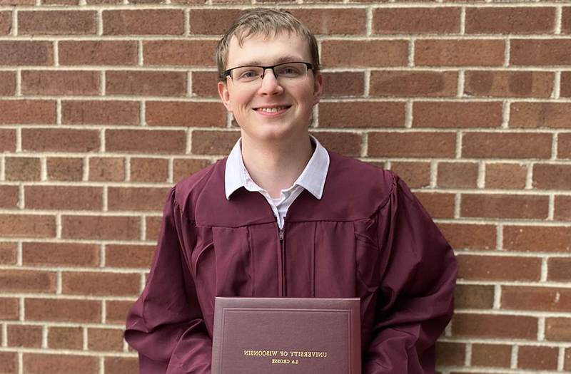RARE Scholars program alum Josh Eckerman with his college diploma